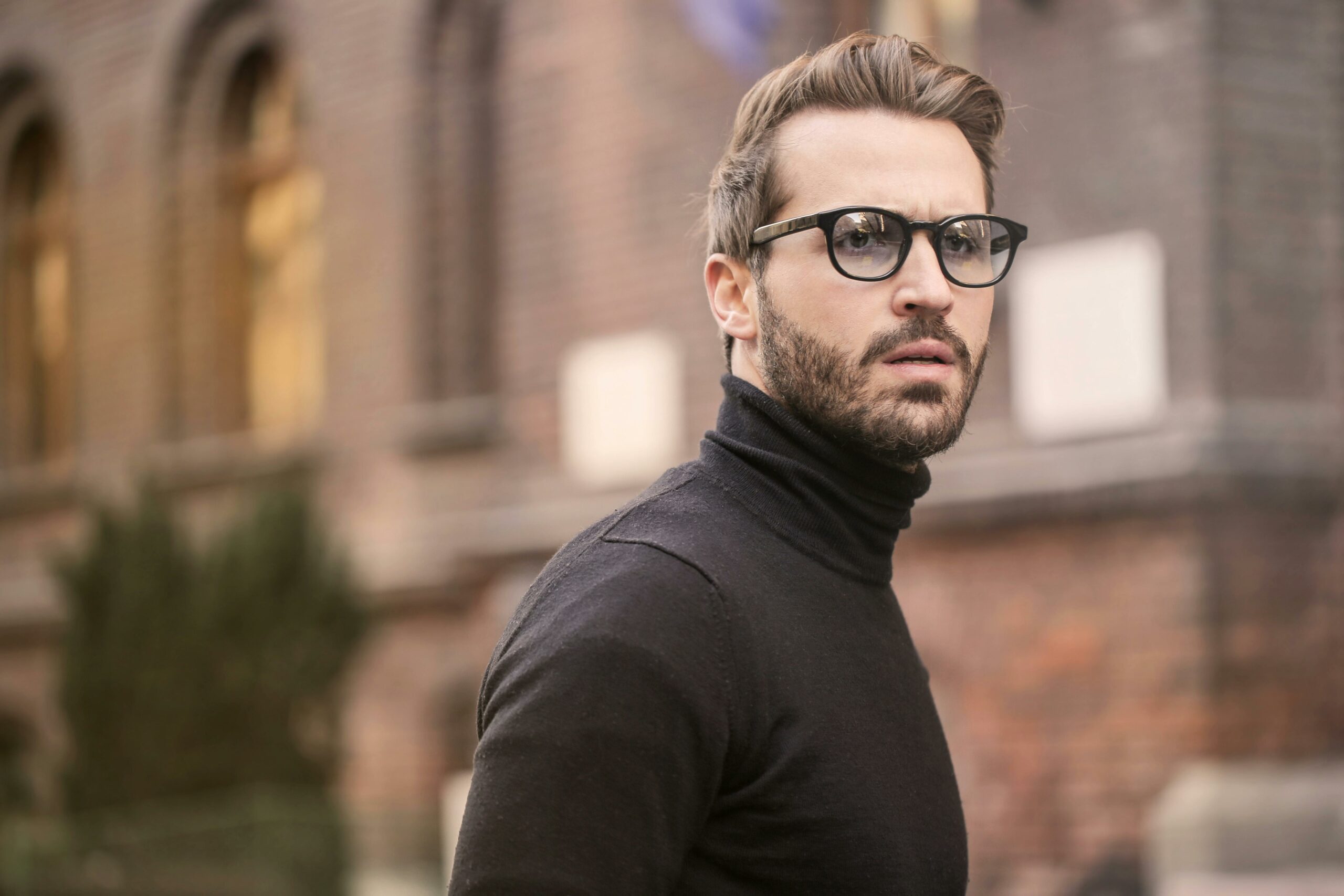 Man wearing stylish eyeglasses – example of influencer used in optical store promotion